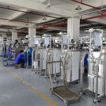 Engineer repairing packaging machine