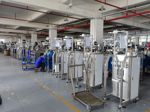 Engineer repairing packaging machine