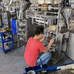 Engineer installing parts