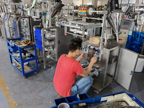 Engineer installing parts