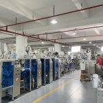 Engineer inspects packaging machine